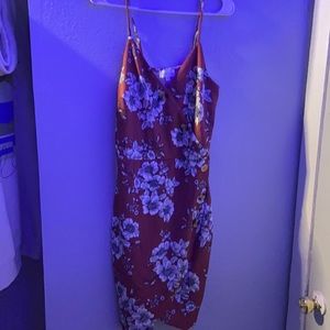 a Burgundy dress with black and white flowers